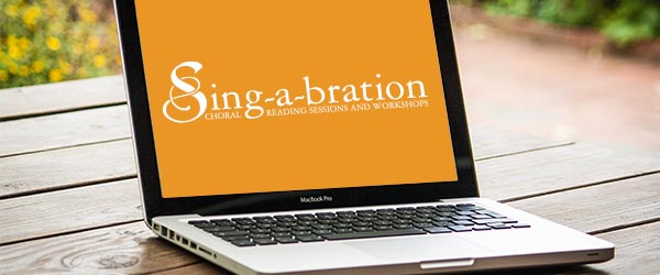 laptop showing sing-a-bration logo